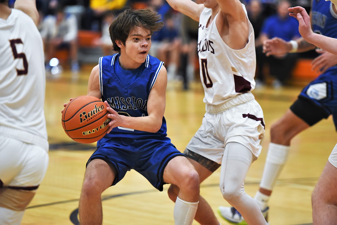 Mission's Zoran LaFrombois looks for an opening in the Florence-Carlton defense on Saturday. (Scot Heisel/Lake County Leader)