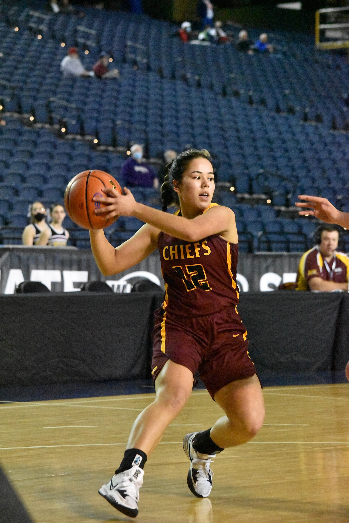 Moses Lake High School junior Marissa Bischoff (12) passes the ball during the state tournament matchup against Emerald Ridge on Feb. 2.