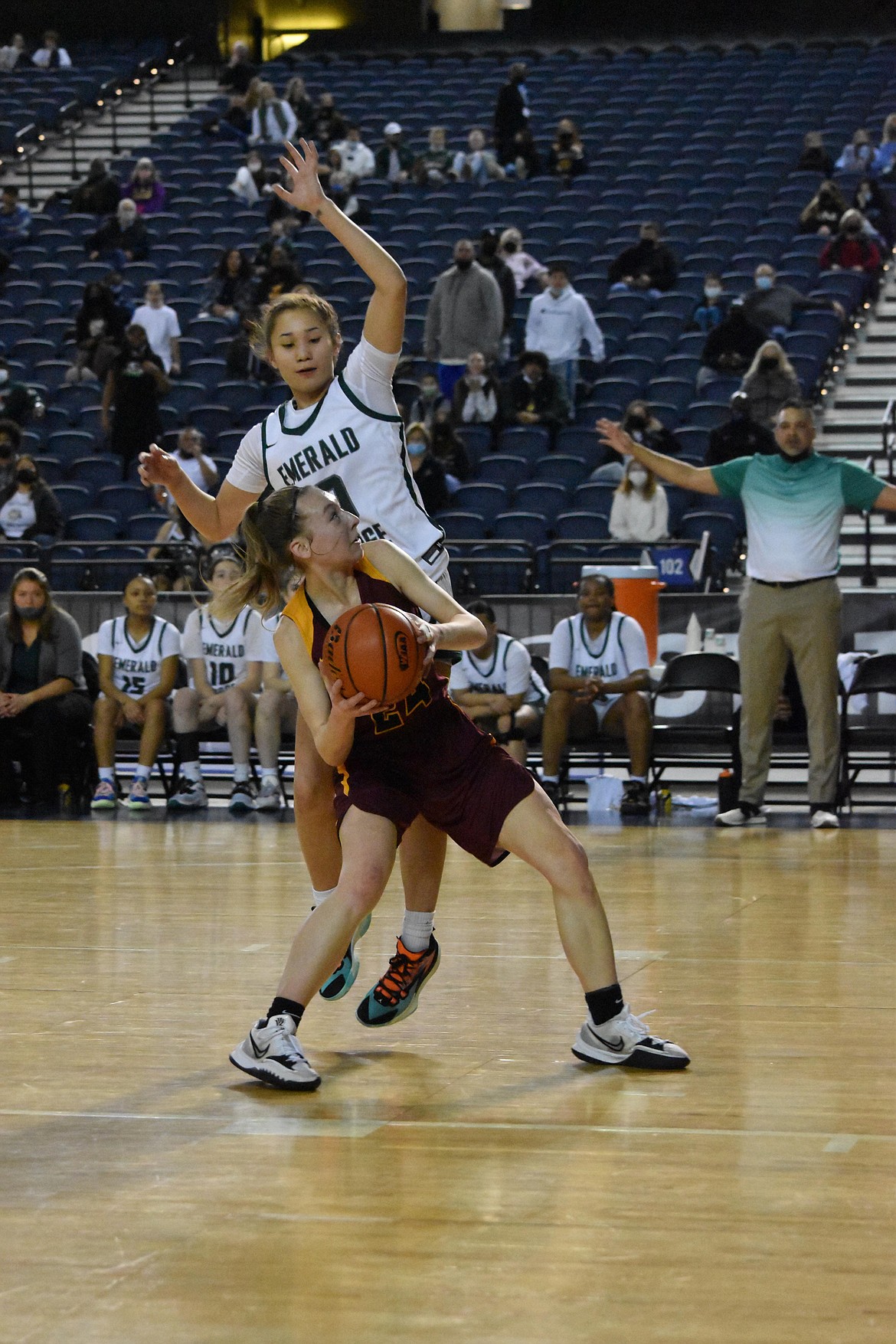 Moses Lake High School’s Teagan Wiltbank (24) as an Emerald Ridge player attempts to block the shot at the Tacoma Dome on Feb. 2.