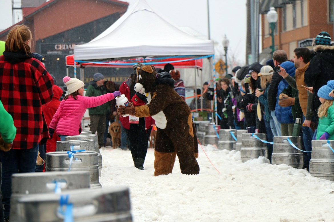 A competitor takes part in Sunday's K9 Keg Pull, a fan favorite at the Sandpoint Winter Carnival.