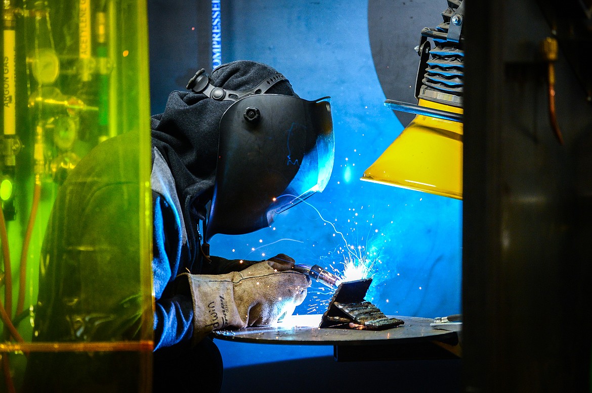 Flathead High School senior Wyatt Newsome practices tube-to-plate welding in one of the bays at the H.E. Robinson Agricultural Education Center in Kalispell on Wednesday, March 2. (Casey Kreider/Daily Inter Lake)