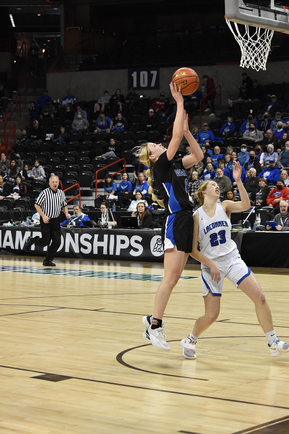 Warden High School sophomore Lauryn Madsen (0) goes in for a layup during the state matchup against La Conner on March 3 at the Spokane Arena.