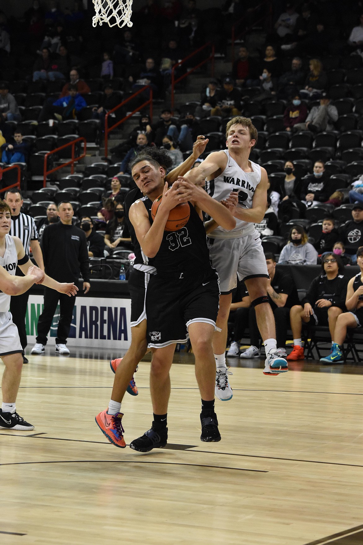 ACH senior Dane Isaak (12) tries to get his hands on the ball during the matchup against Lummi Nation on March 3 at the WIAA 1B boys state basketball tournament.