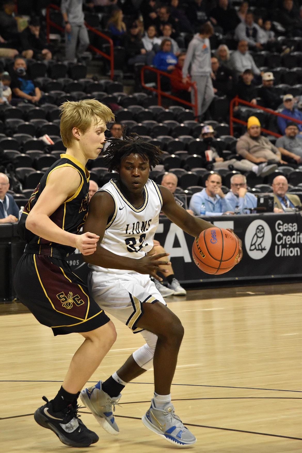 MLCA/CCS senior Pierre Boorman (32) maneuvers around an opponent on March 3 during the WIAA state tournament.