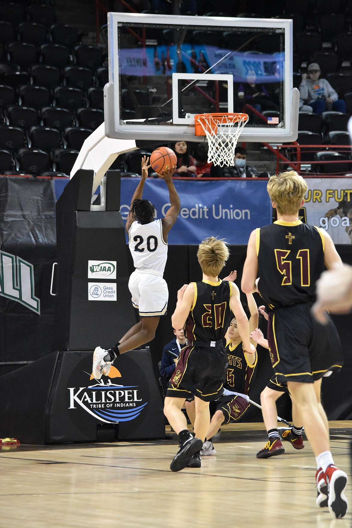 MLCA/CCS Jeff Boorman (20) makes a layup during the matchup against Sunnyside Christian at the WIAA state 1B boys basketball tournament on March 3.