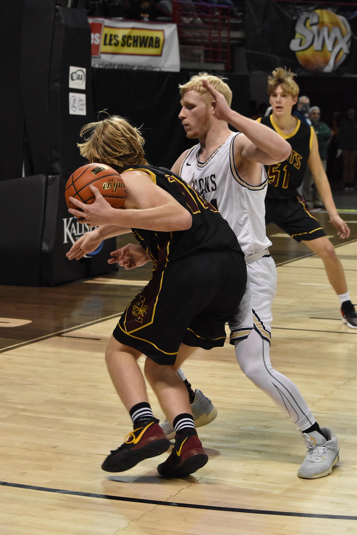 MLCA/CCS senior Jacob Robertson (24) guards a Sunnyside Chrisitan opponent during the final minutes of the state matchup on March 3.