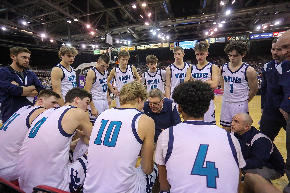 JASON DUCHOW PHOTOGRAPHY
Lake City High boys basketball coach Jim Winger gives his team instruction during Thursday's state 5A quarterfinal game against Centennial High of Boise at the Ford Idaho Center. Lake City, which fell 72-67 to the Patriots of Boise, will face Eagle today in a loser-out game at 11 a.m. PST at Rocky Mountain High in Meridian.