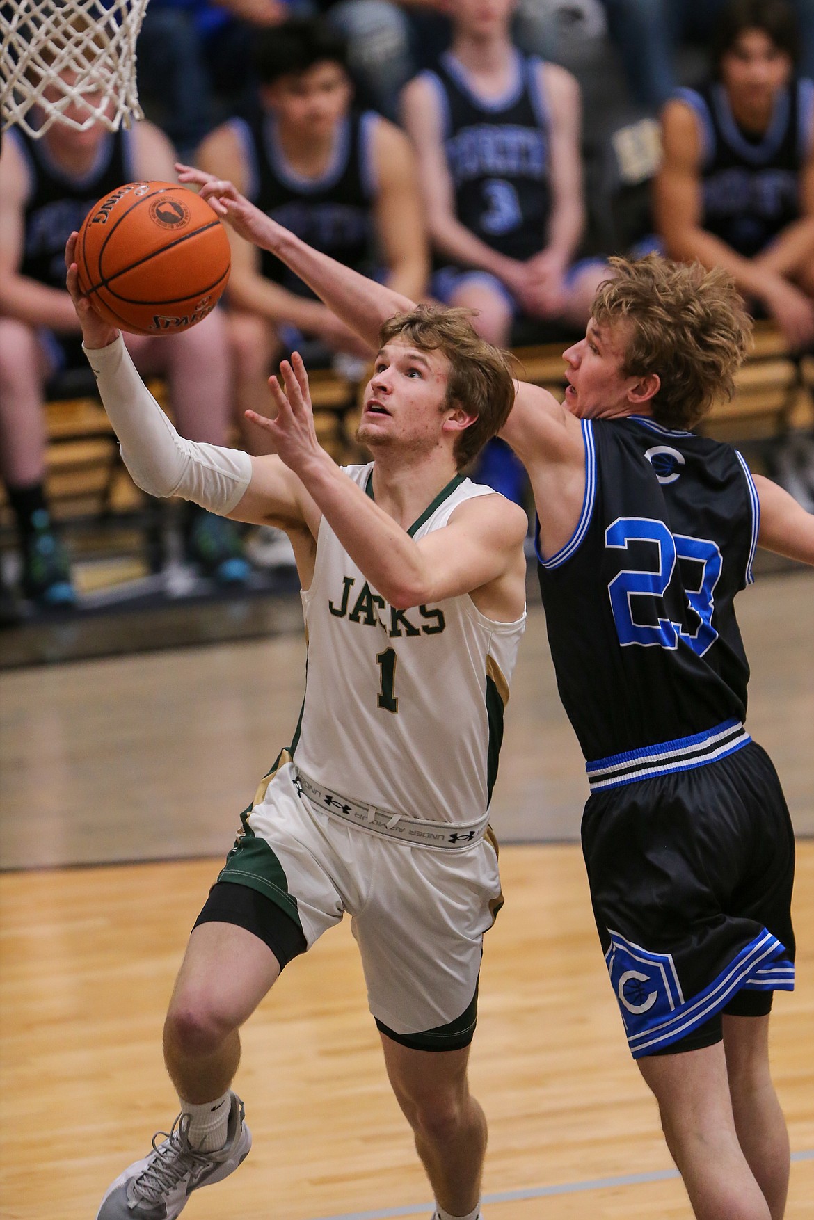 JASON DUCHOW PHOTOGRAPHY
St. Maries junior guard Greyson Sands drives past the defense of Firth's Bridger Holley during Thursday's state 2A quarterfinal game at Capital High in Boise.