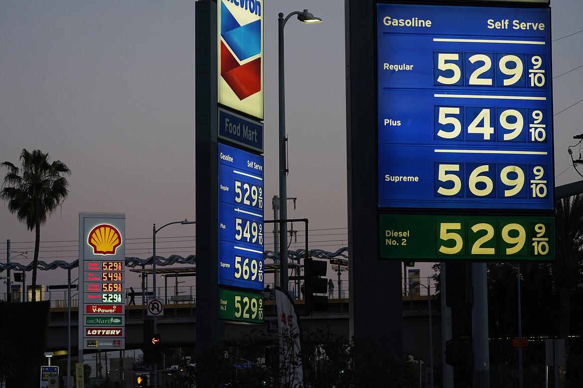 Gas prices are advertised at over five dollars a gallon Monday, Feb. 28, 2022, in Los Angeles. (AP Photo/Marcio Jose Sanchez)