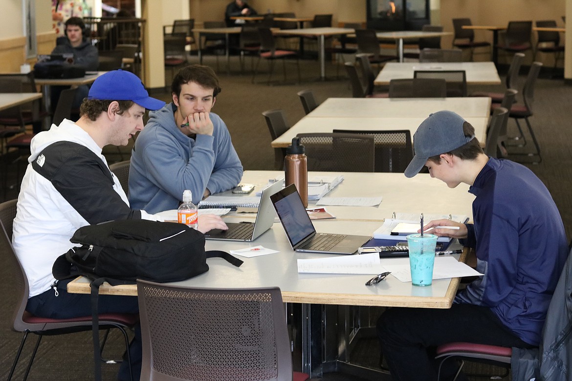 From left, North Idaho College students Nick Farnham, Dominic Rey and Kyle Edmundson study for their physics midterm on Friday at the Edminster Student Union Building on NIC's main campus in Coeur d'Alene. HANNAH NEFF/Press