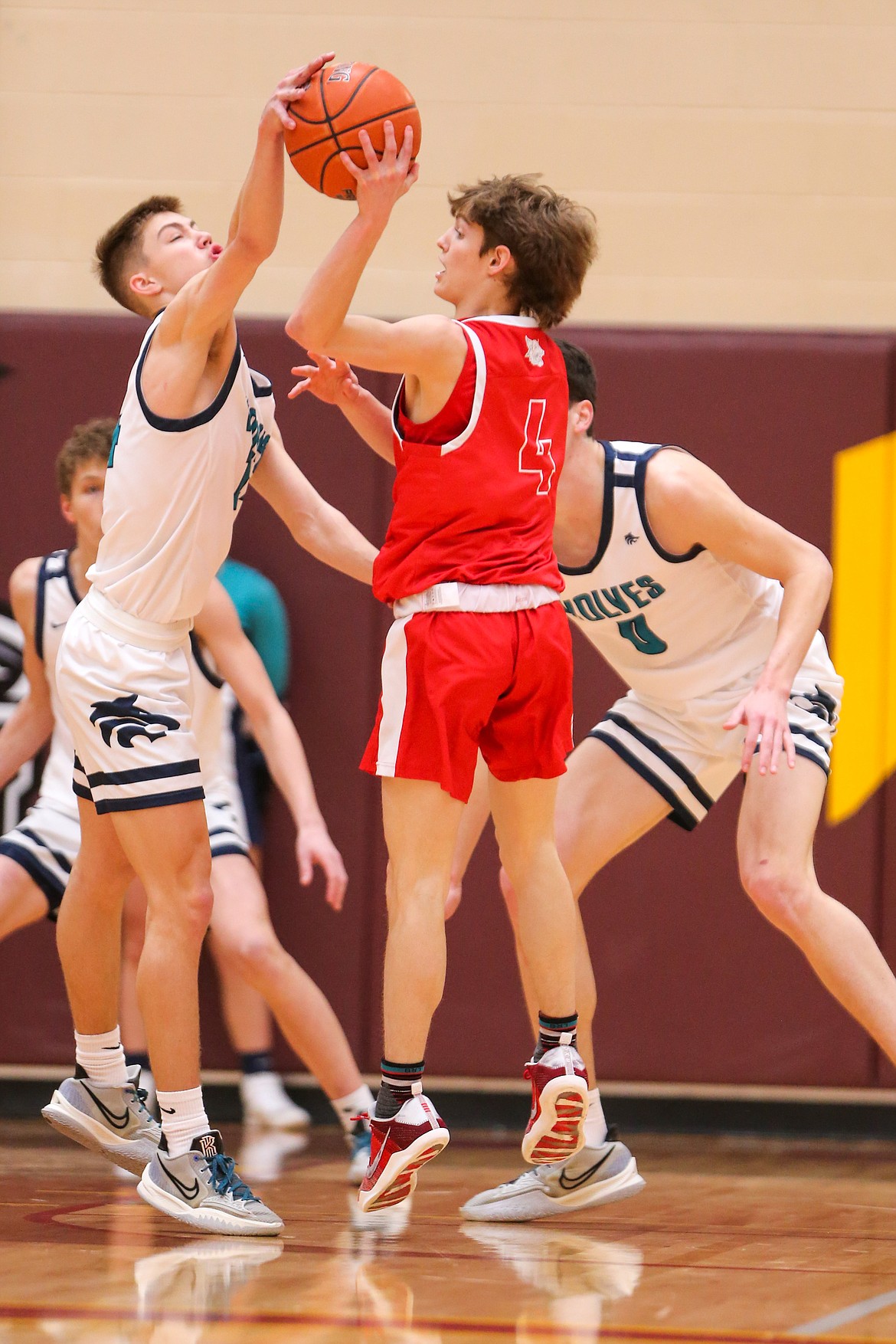 JASON DUCHOW PHOTOGRAPHY
Lake City junior guard Kolton Mitchell deflects the pass of Madison's Ike Sutton during Saturday's state 5A boys basketball consolation championship game at Columbia High in Nampa.