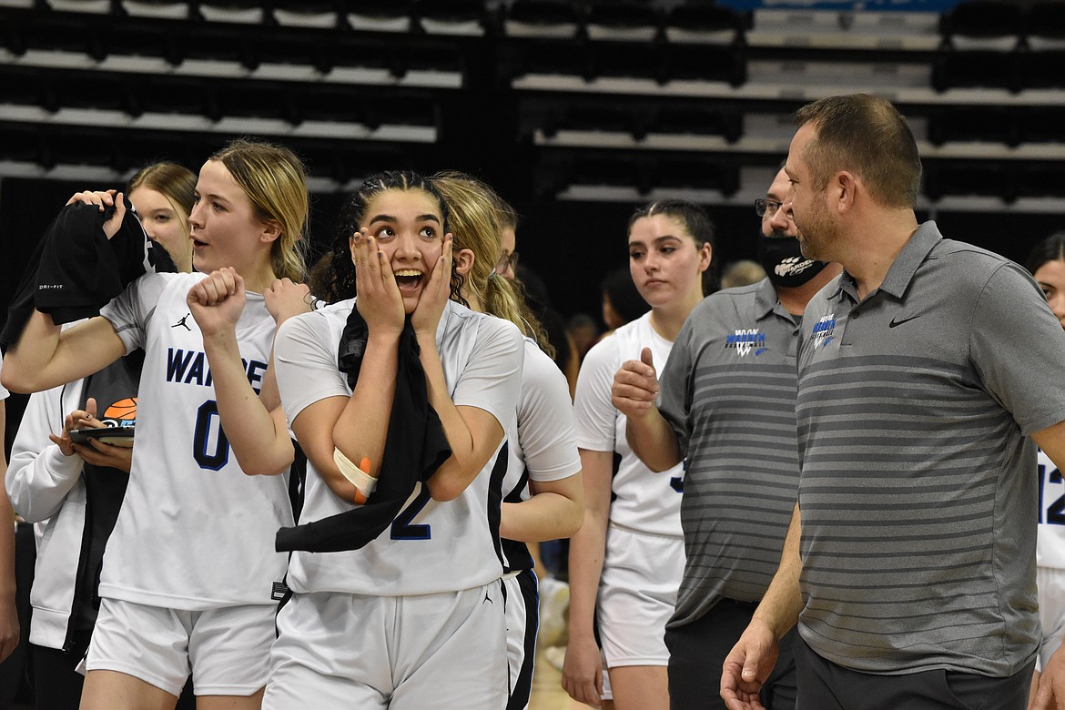 Warden High School senior Kiana Rios (32) puts her hands up to her face in shock and joy right after beating Okanogan on March 4 at the state basketball tournament to move on to the championship game.