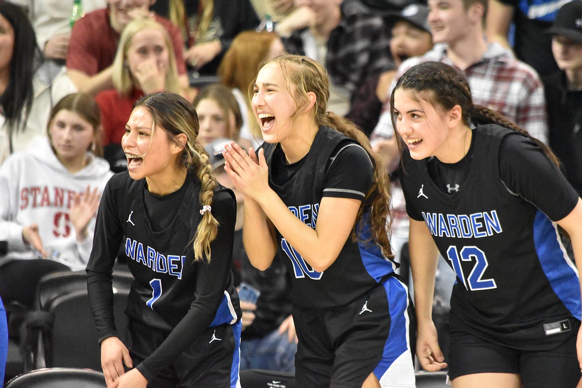 From left to right, Warden High School senior Arely Rangel (1), junior Kaylee Erickson (10) and sophomore Aliza Leinweber (12) cheer on their teammates from the bench during the WIAA girls 2B state championship game on March 5.