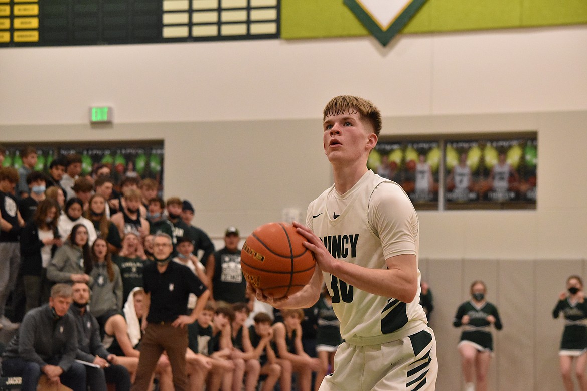 Quincy High School senior Aidan Heikes (30) prepares to shoot a free throw during the Jan. 25 matchup against Chelan High School. Heikes is the sixth ever to make the 1,000 point club at Quincy High School.