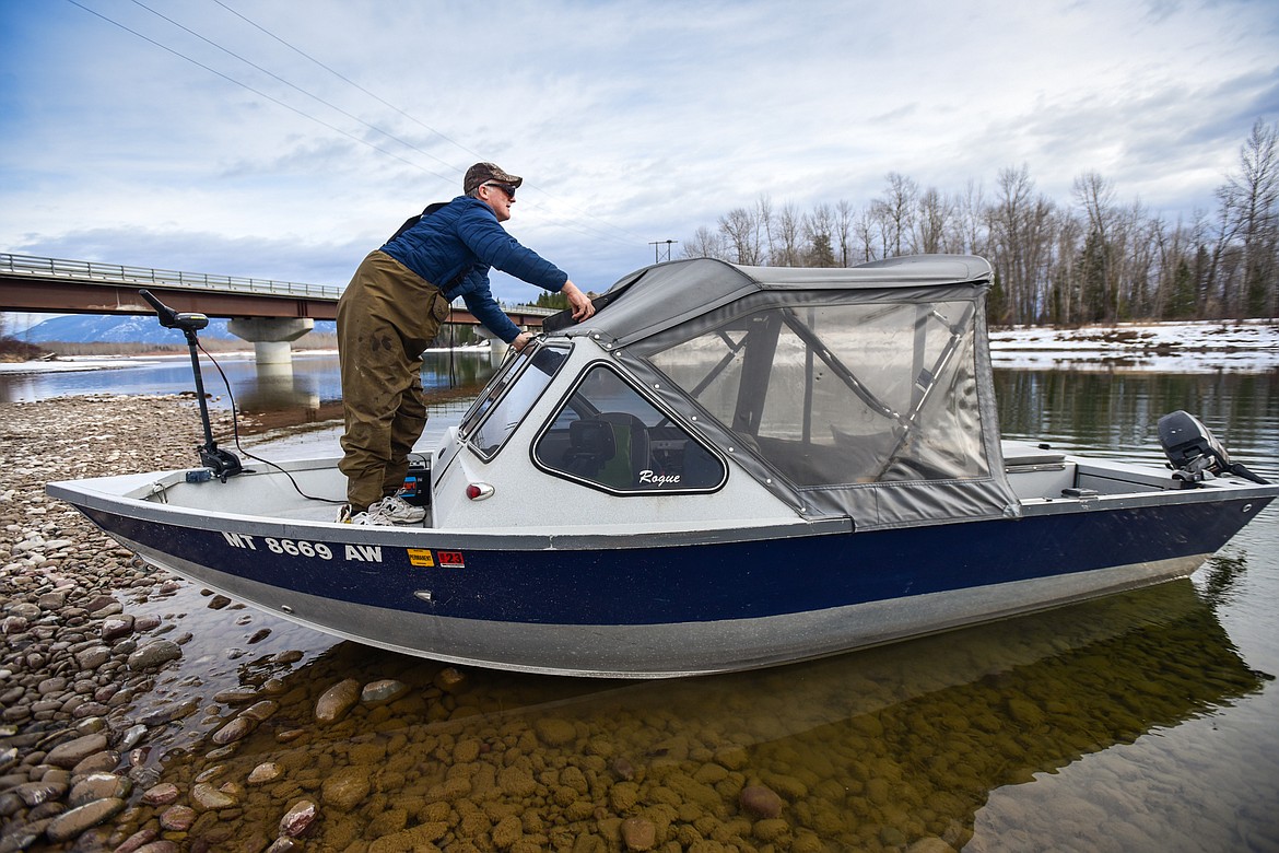 Dag Jenshus readies his boat while he waits for a fishing buddy at the Old Steel Bridge Fishing Access on the Flathead River. (Casey Kreider/Daily Inter Lake)