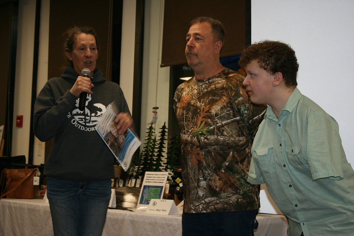 Youth Outdoors Unlimited co-founder Cindy Carpenter (left) introduces trophy recipient Cyrus Levine (right) and YOU board member Martin Monsey (center), who accompanied Cyrus on his hunting trip.