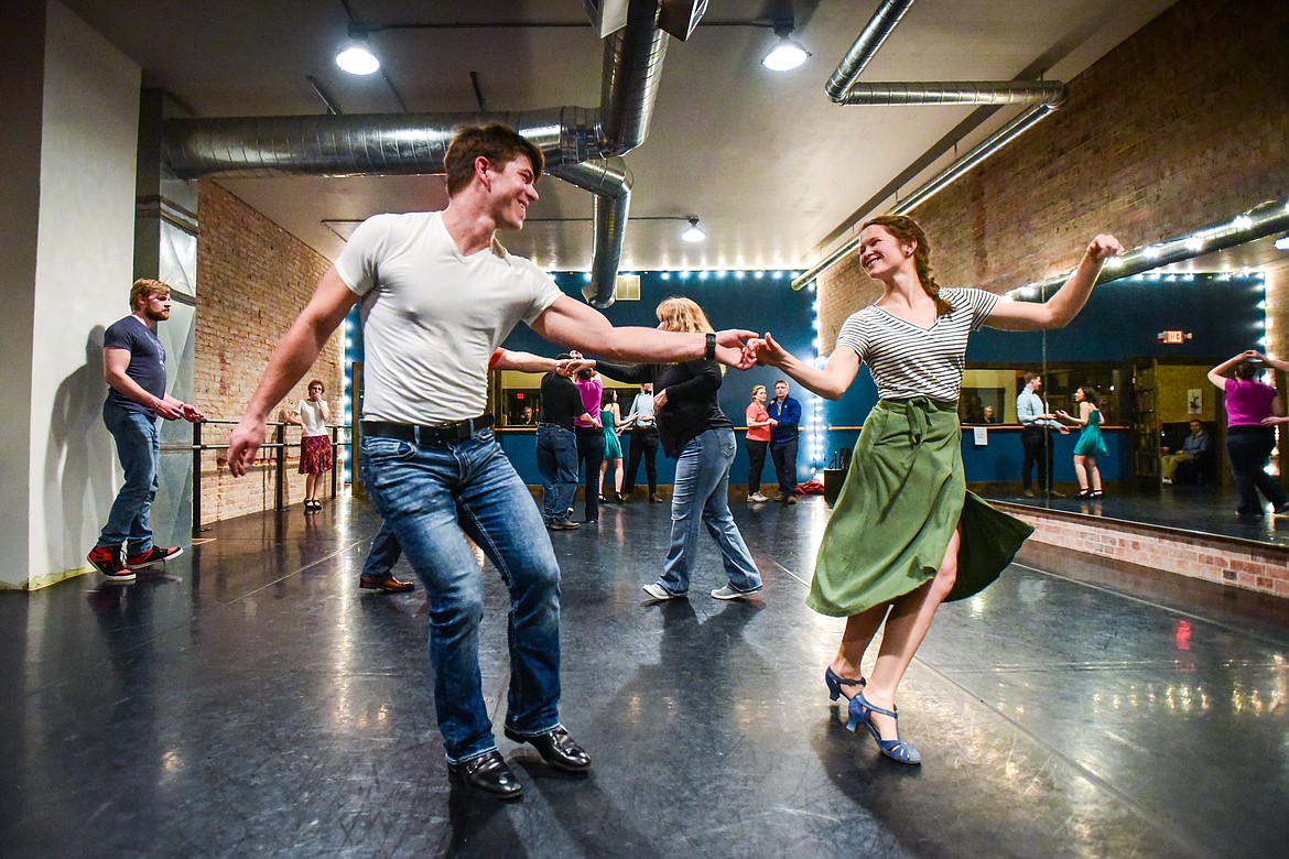 Nathanael Probert and Hana Head dance the Lindy Hop during a social dance and beginner lesson held by North End Swing at Noble Dance in Kalispell on Friday, March 4. (Casey Kreider/Daily Inter Lake)