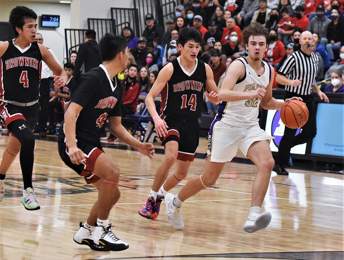 Colton Graham takes the ball upcourt during a home game against Browning. (Scot Heisel/Lake County Leader)