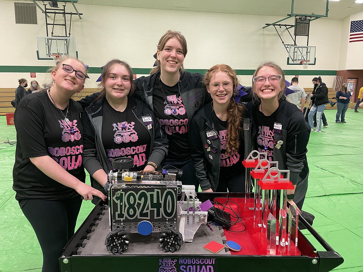 The RoboScout Squad team celebrates winning the FIRST Tech Challenge state tournament held March 5 in Belgrade. (L to R) Lexi Nunnally, a  senior at Glacier High School, Jessie Chadwick and Katie Eberhardy, both juniors at Flathead High School and Flathead sophomores Zia Walker and Kennedy Dortch with their robot Grover.