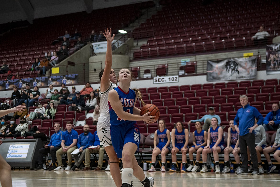 Columbia Falls’ Hope McAtee drives towards the basket against Billings Central on Wednesday at the State A basketball tournament. (JP Edge/Hungry Horse News)