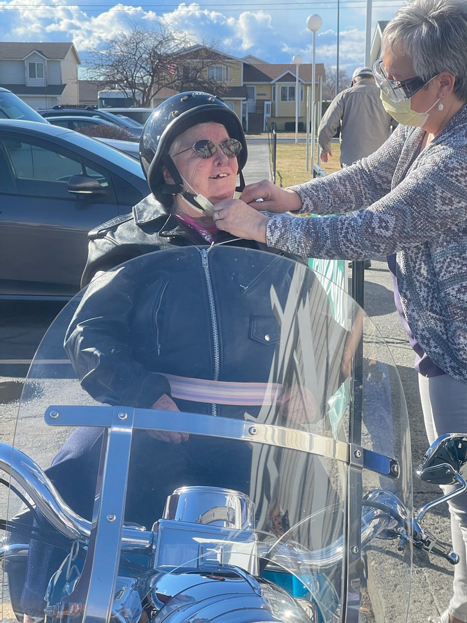 Edna Watkins buckles on her helmet for her first motorcycle ride on her 102nd birthday.