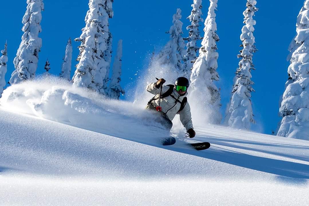 A skier floats through fresh powder at Great Northern Powder Guides (courtesy photos).