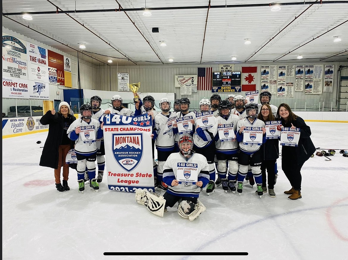 The Flathead Fusion 14U girls hockey team poses with the trophy after winning its fourth state title at the MAHA State Tournament last week. (Photo courtesy Lini Reading/Flathead Fusion)