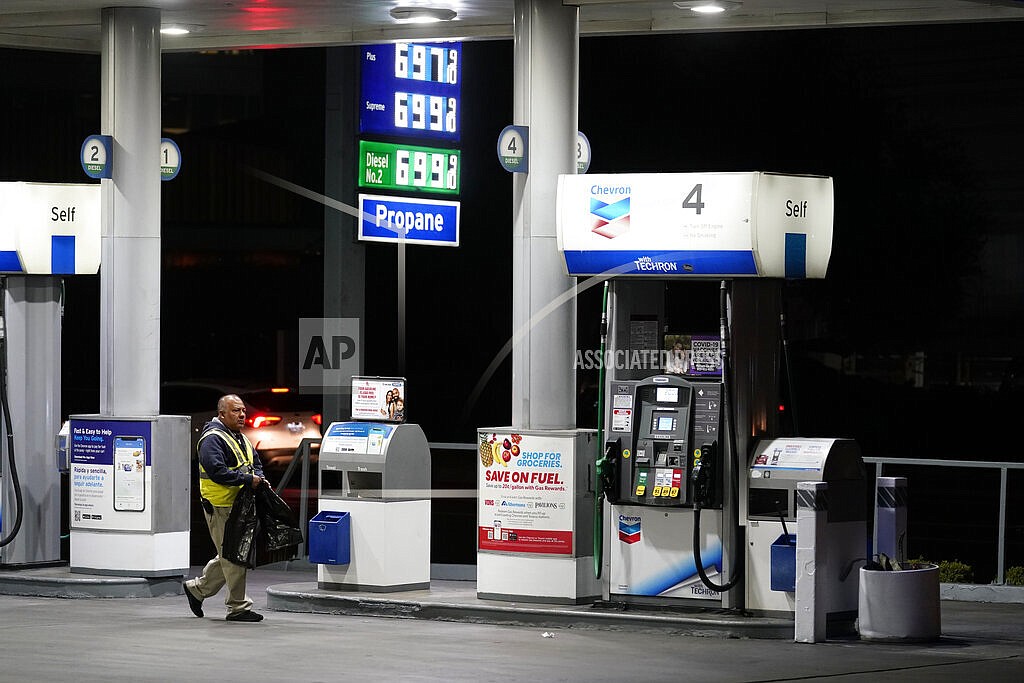 An attendant walks past a pump at a station selling gas at over $6 a gallon, Monday, March 7, 2022, in Los Angeles. Governors and state lawmakers across the U.S. are scrambling to provide relief from soaring prices at the gas pump. They are discussing ways to lower or suspended gas taxes, but taking that step has not proved easy, since much of that money goes toward repair of roads and bridges. (AP Photo/Marcio Jose Sanchez, File)