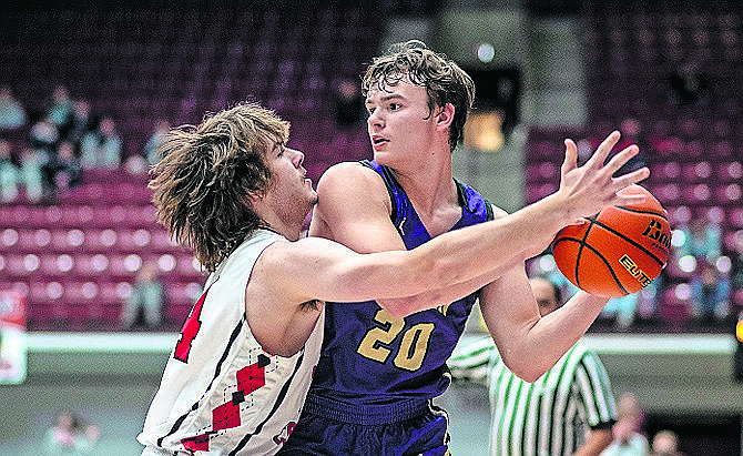 Polson's Jarrett Wilson looks for an open teammate. Wilson led the team in scoring with 17 points on Thursday in Missoula at the State A basketball tournament. (JP Edge/Hungry Horse News)