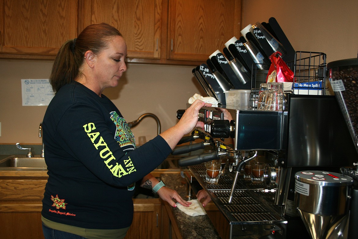 Alisha Avalos, owner of Sky’s Coffee in Mattawa, prepares coffee for a customer. Avalos started the business after family needs required her to find something more flexible than her work at the Whaluke School District.