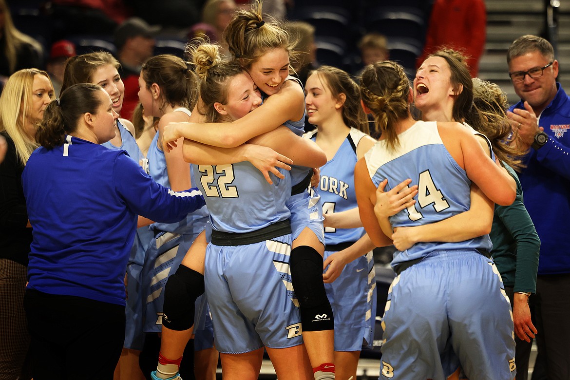 The Valkyries celebrate after earning the Bigfork Girls first win at the 2022 state tournament in Bozeman Friday morning. Bigfork downed Columbus, 48-44. (Jeremy Weber/Bigfork Eagle)