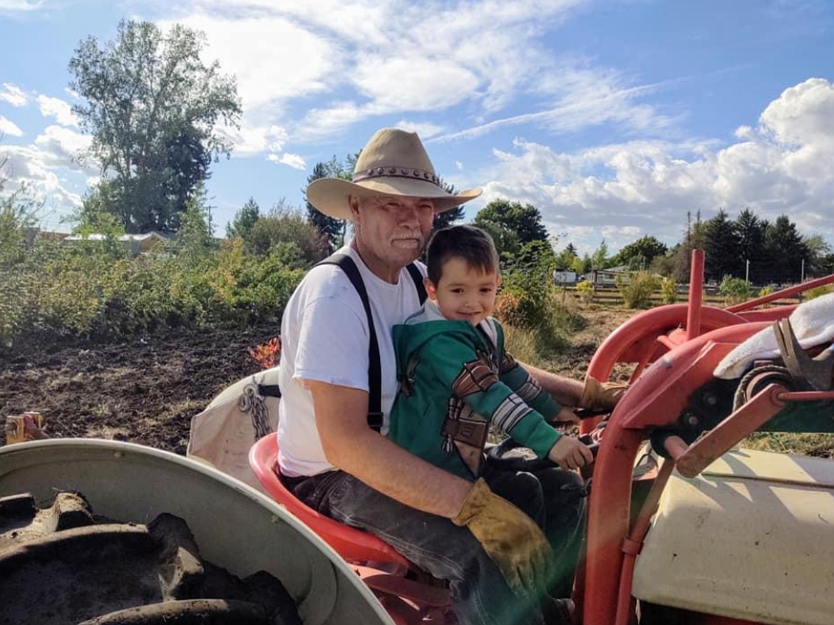 Bryan Martin with his youngest grandson Aaron Martin in their garden. Photo courtesy of Valerie Martin