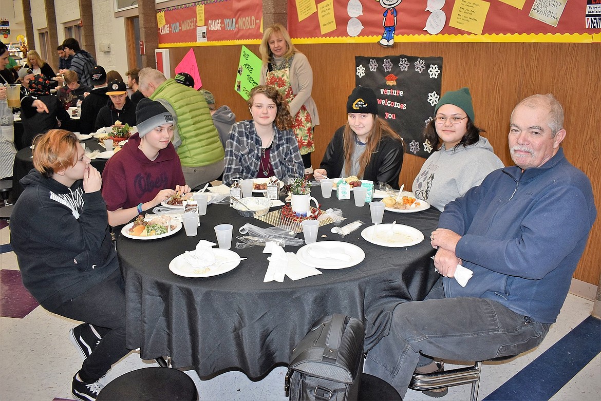 Bryan Martin, right, shares a holiday meal with students at Venture High School. Photo courtesy of the Coeur d'Alene School District