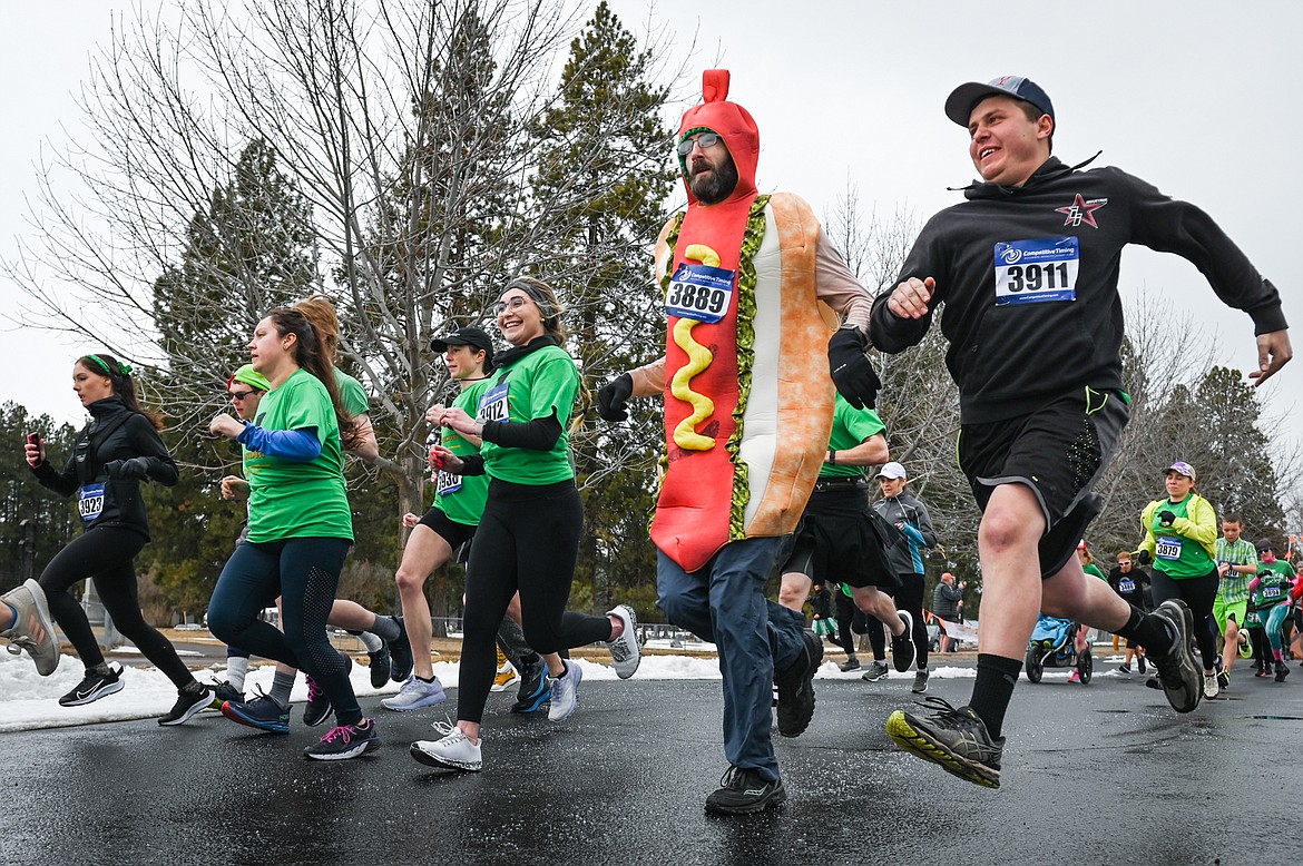 Participants start the 5K race at Cloverfest at the Super 1 Foods in Columbia Falls on Saturday, March 12. The event also included a kids' carnival, fun run, live music, food trucks, local spirits and St Patrick’s Day activities and games. (Casey Kreider/Daily Inter Lake)