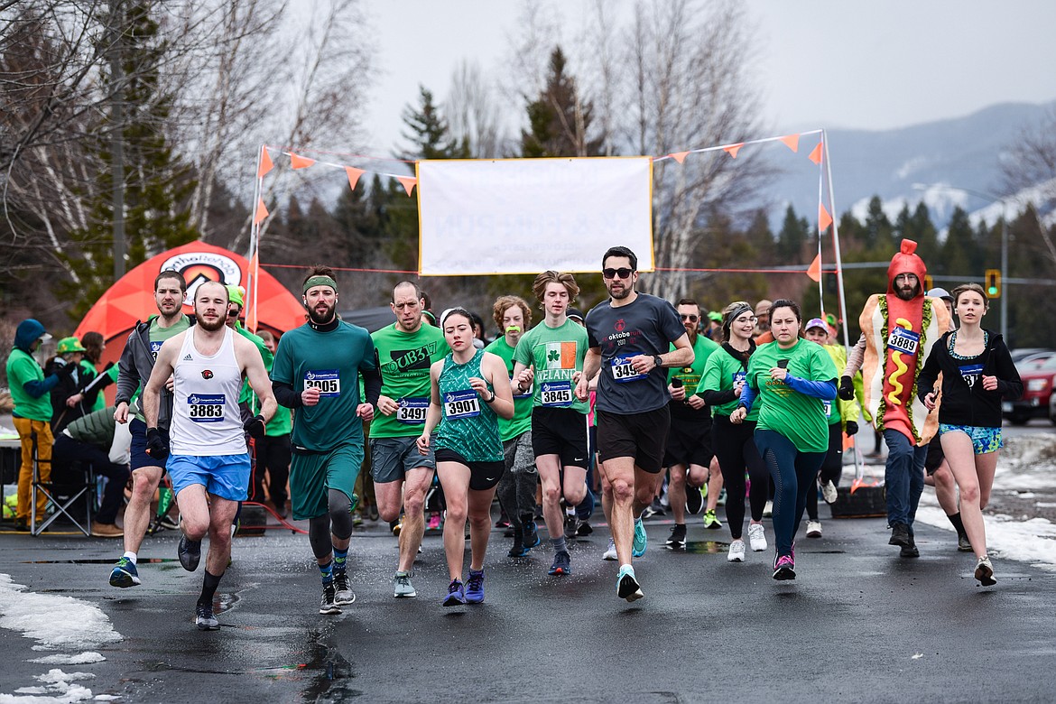 Participants start the 5K race at Cloverfest at the Super 1 Foods in Columbia Falls on Saturday, March 12. The event also included a kids' carnival, fun run, live music, food trucks, local spirits and St Patrick’s Day activities and games. (Casey Kreider/Daily Inter Lake)