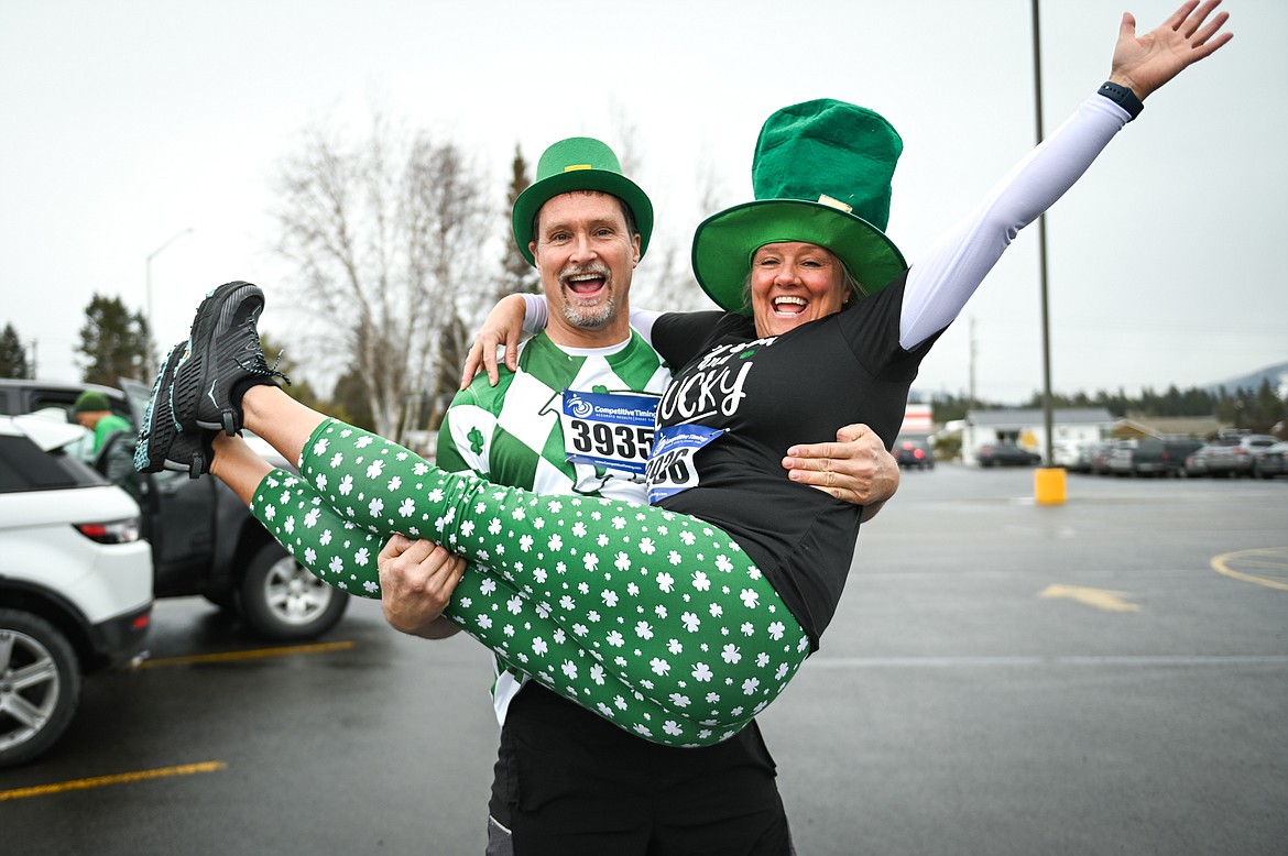 Gene Sampson and Angel Dodd are ready to run in the 5K race at Cloverfest at the Super 1 Foods in Columbia Falls on Saturday, March 12. The event also included a kids' carnival, fun run, live music, food trucks, local spirits and St Patrick’s Day activities and games. (Casey Kreider/Daily Inter Lake)