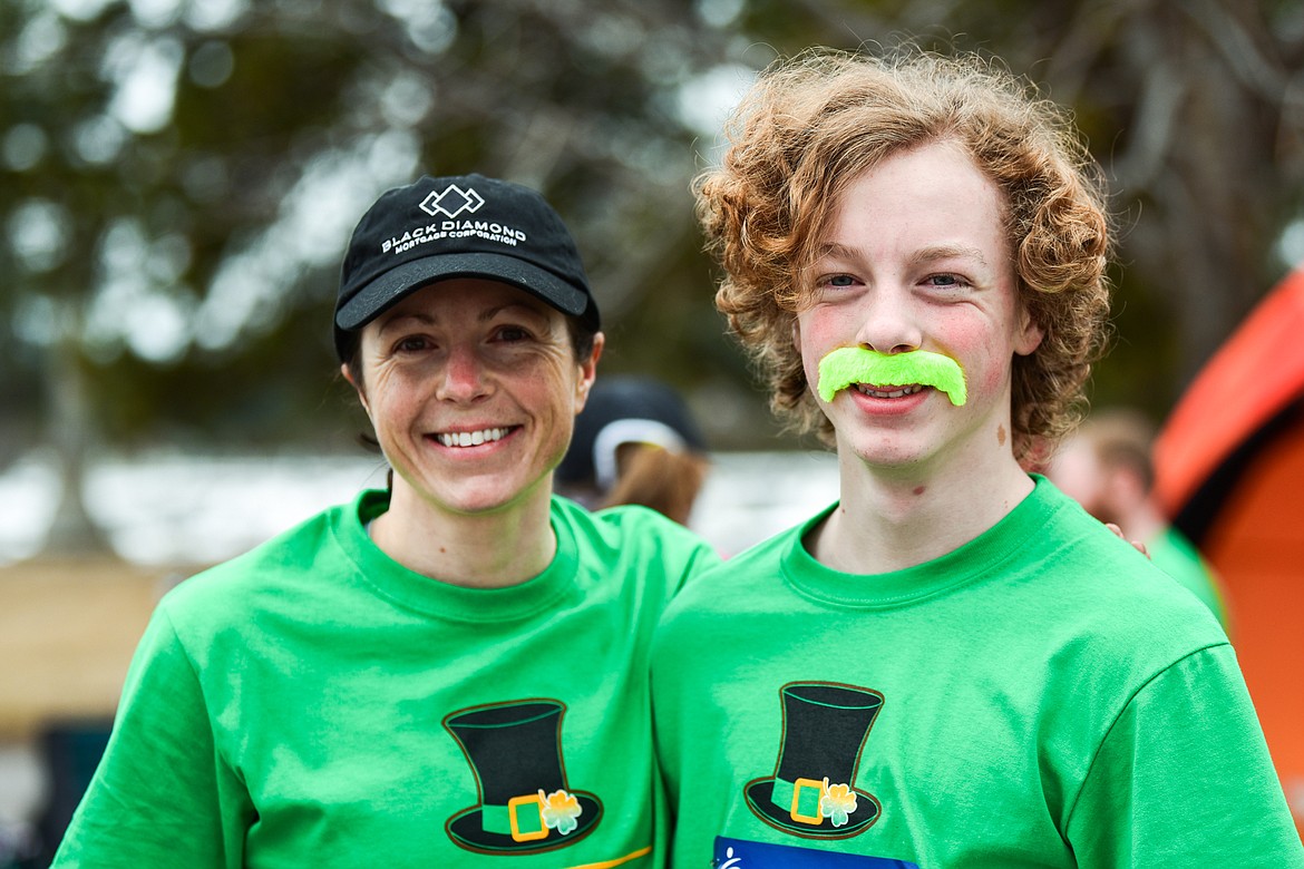 Maria Phelps and her son Jack get ready for the 5K race at Cloverfest at the Super 1 Foods in Columbia Falls on Saturday, March 12. The event also included a kids' carnival, fun run, live music, food trucks, local spirits and St Patrick’s Day activities and games. (Casey Kreider/Daily Inter Lake)