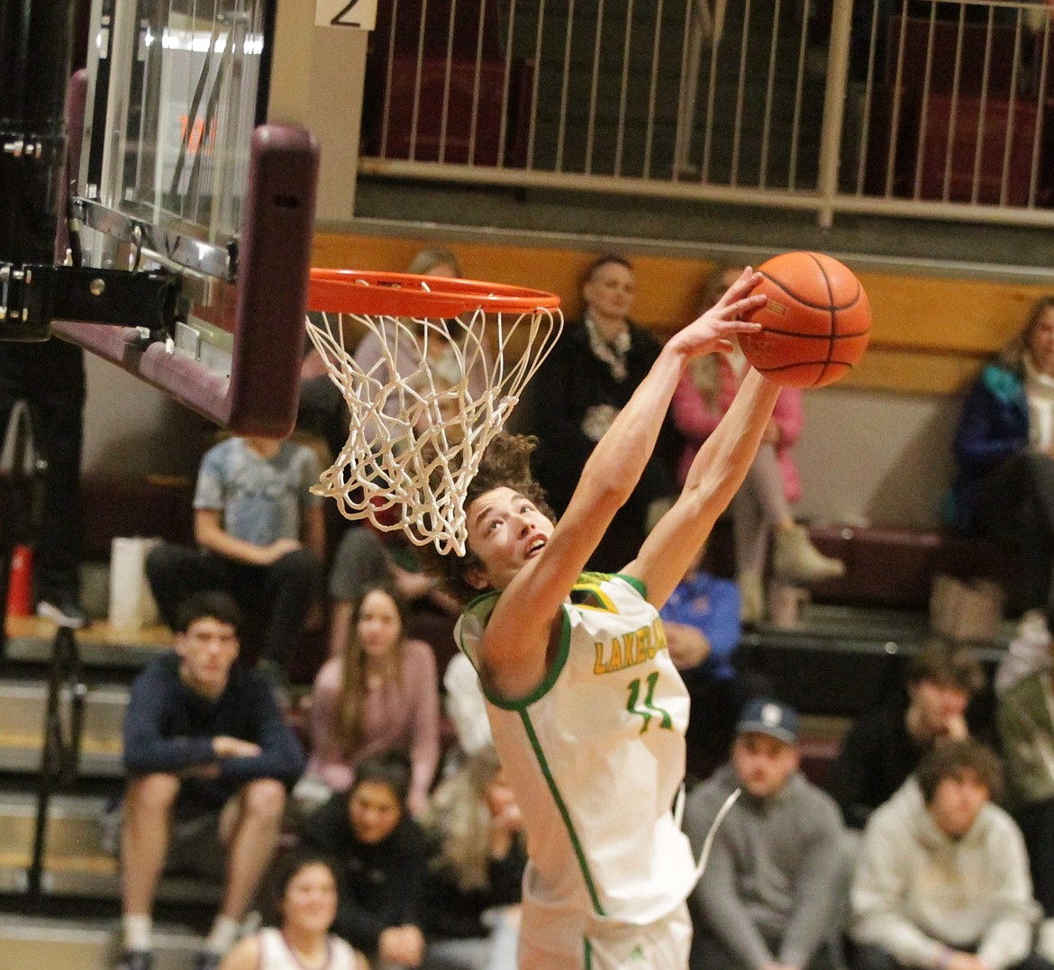 JASON ELLIOTT/Press
Lakeland High senior Bryce Henry looks to put away his dunk attempt during the first round of the boys slam dunk contest at North Idaho College on Saturday.