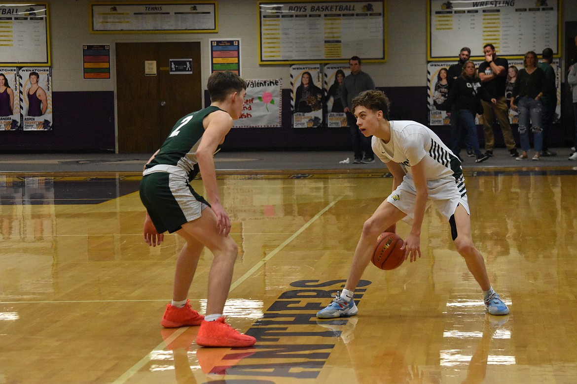 TreyVaughn Bierlink faces off against a Chelan player during their matchup for the district title Feb. 11. The Jacks went on to take the trophy home.