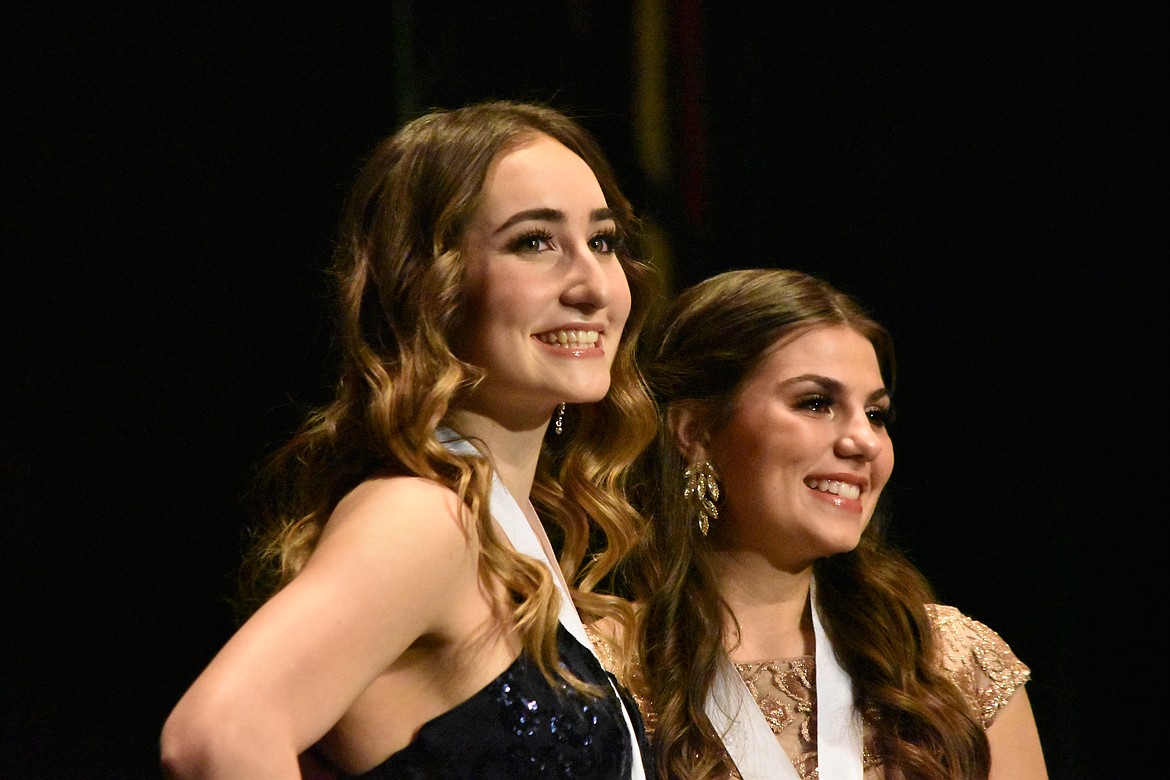 Moses Lake’s 2022 distinguished young woman Esther Roeber (left) poses with the new Moses Lake 2023 distinguished young woman Emma Fulkerson (right)just after the announcement that Fulkerson had won.