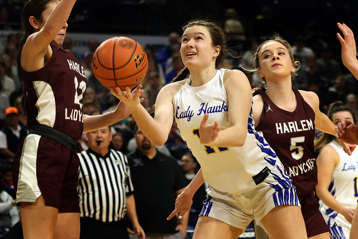 Thompson Falls forward Caity Alexander drives the lane for a scoop shot against Harlem in a loser-out game at the State B Basketball Tournament in Bozeman Friday. (Jeremy Weber/Bigfork Eagle)