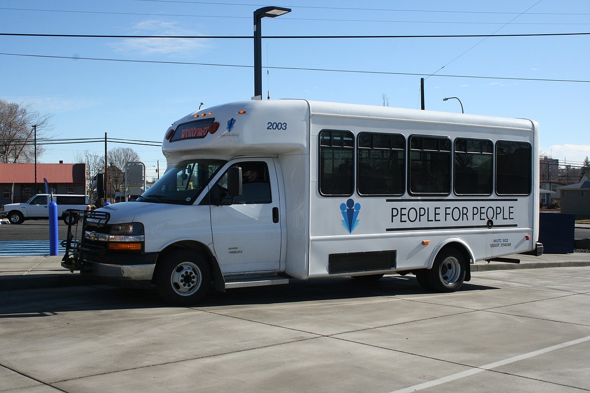 The People for People bus waits to pick up passengers at the start of its run to Tri-Cities.