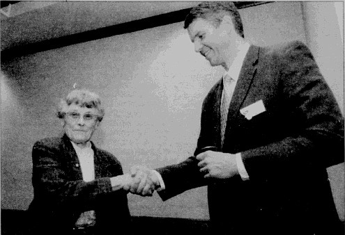 Longtime community leader Marge Fisher accepts the Great Whitefish award from Whitefish Chamber Board Chairman John Anderson in 2011. (Pilot file photo)