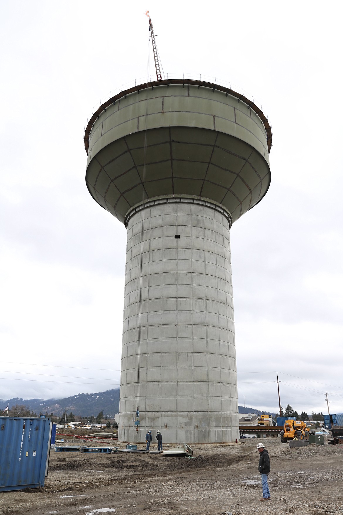 The new 2 million gallon water tank for the Hayden Lake Irrigation District was lifted to the top of the water tower on Friday morning. The water tower will be 161 foot tall at the top when completed. Keith Mead of Chicago Bridge and Iron stands in the foreground. HANNAH NEFF/Press