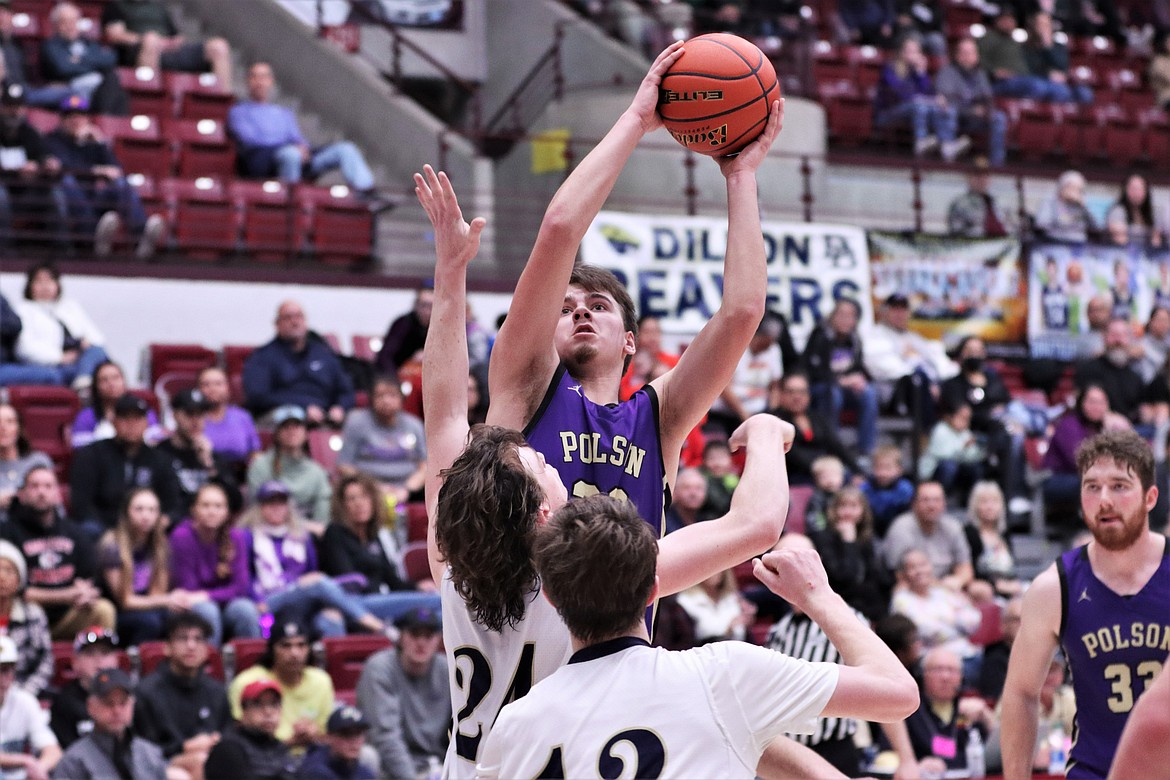 Colton Graham shoots over Havre defenders at the state tournament. (Courtesy of Niki Graham)