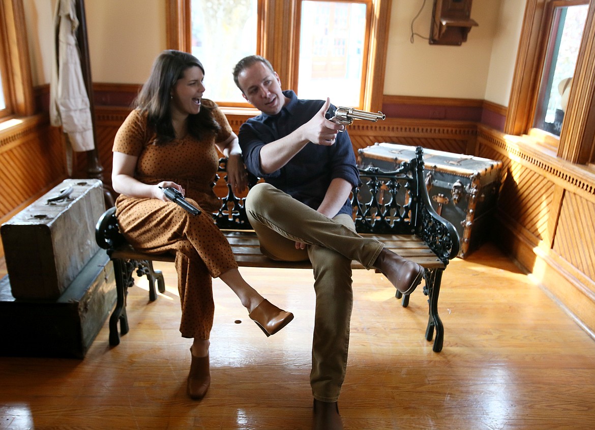 Wendi Yellin smiles as her husband and entertainment partner Luke Yellin aims his prop gun in the train depot at Silverwood. The two will debut a new act on the train this season.