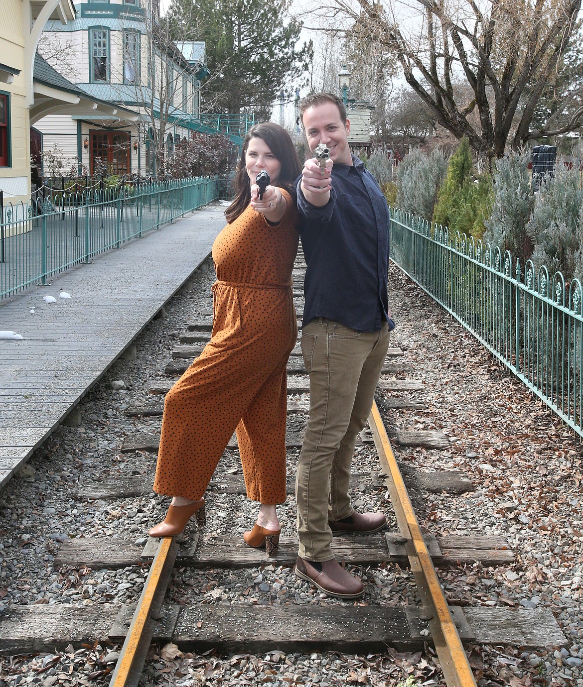 Ready, aim, fun: Prepare for a wild ride back to 1915 North Idaho with Wendi and Luke Yellin, seen here on the train tracks at Silverwood on March 10.