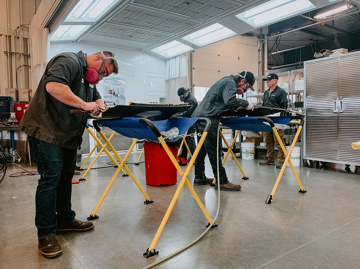 North Idaho College student Bryce Tellinghusen, left, hammers out a dent during an autobody repair competition at NIC’s Parker Technical Education Center on March 4. Photo courtesy of Elli Oba/North Idaho College