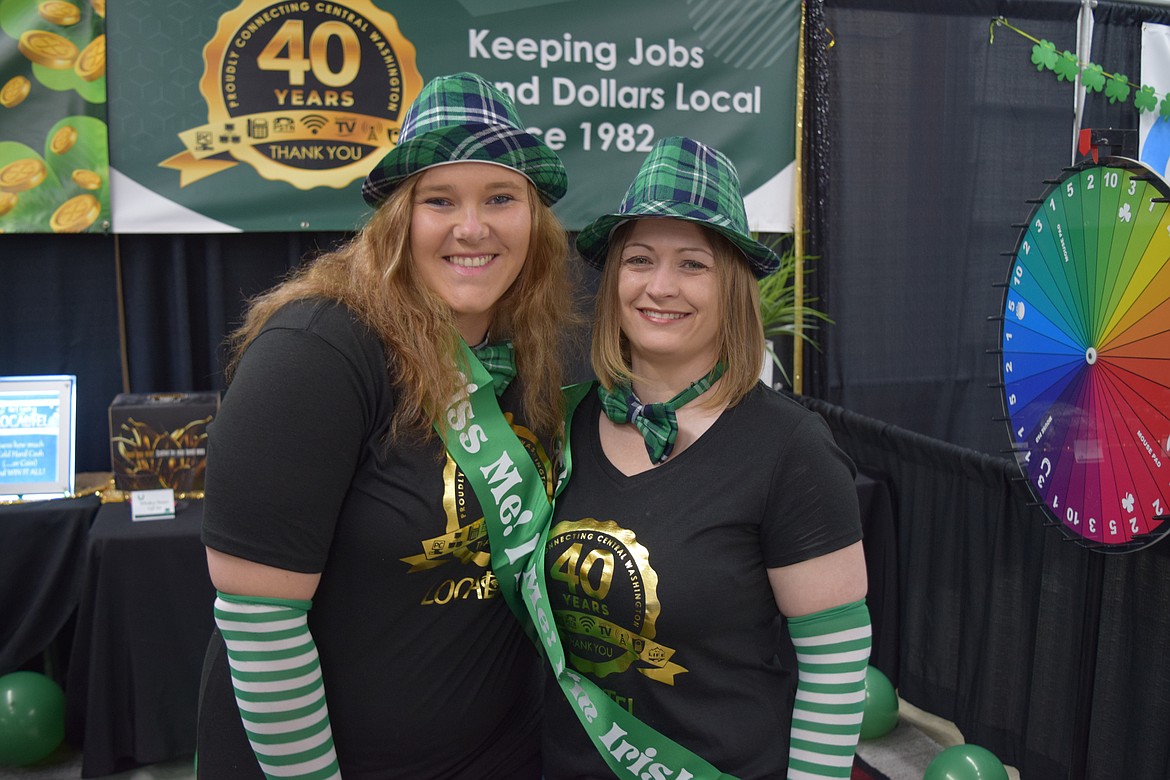 Vanessa Greenwalt and Vicki Rivers of LocalTel, in their St. Patrick’s Day finery, at the St. Patrick’s Business Expo organized by the Moses Lake Chamber of Commerce at the Grant County Fairgrounds on Tuesday.