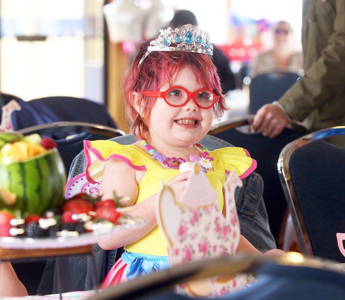 Harper Beare, 5, looks up at her admirers during her Fancy Nancy tea party on a Lake Coeur d'Alene Cruise boat Wednesday.